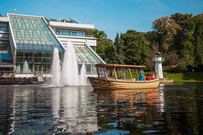 Riga Sightseeing Tour by Canal Boat with Audioguide - Through the Park and Past the Theater, Where the Captain Can Add Context