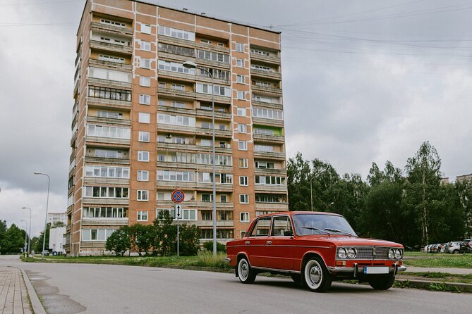 Soviet Riga: Vintage Car Tour & Life Behind the Curtain - Vanšu Bridge ending: cassette music and a symbolic vodka toast